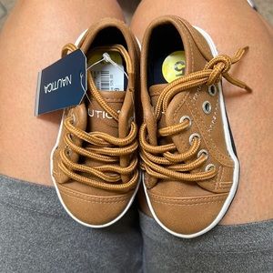 Brown boat shoes. Size 5c. Never worn. No box.